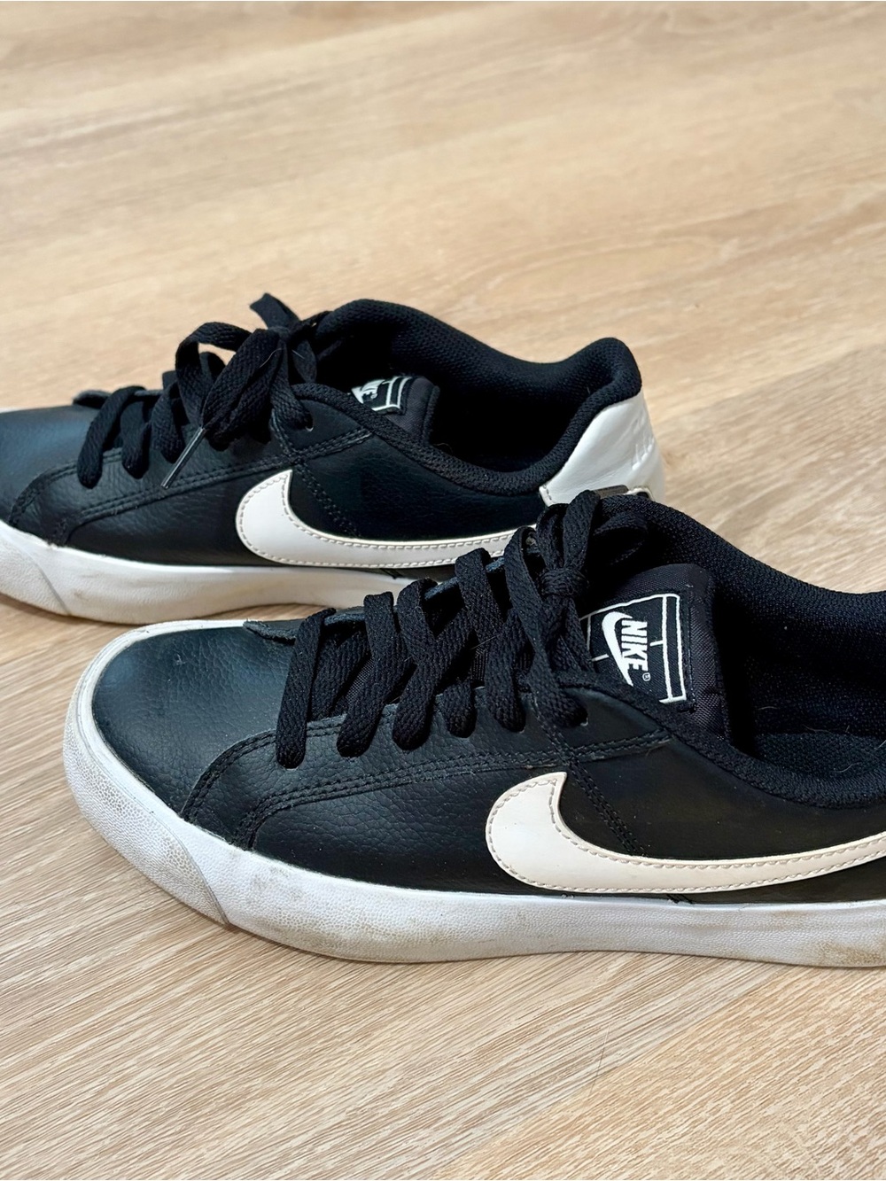 Nike Women’s Leather Black and White Low-Top Sneakers